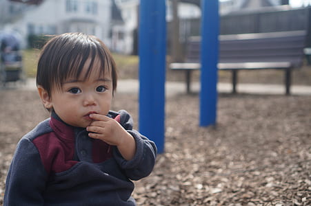 boy standing near to park bench thumbnail