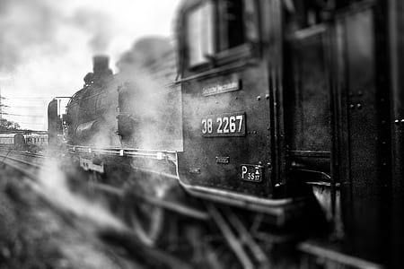 grayscale photo of train during daytime thumbnail
