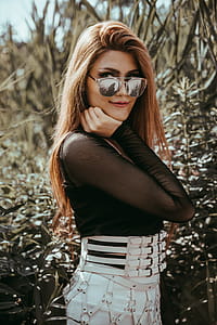 Model Looks Over Sunglasses Photo thumbnail