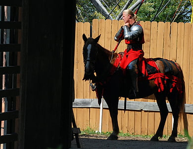 man riding on brown horse near brown wooden fence thumbnail