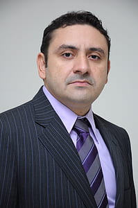 man wearing black suit thumbnail