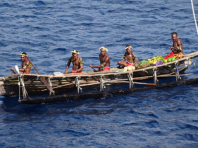 Natives in a boat in Papua New Guinea thumbnail