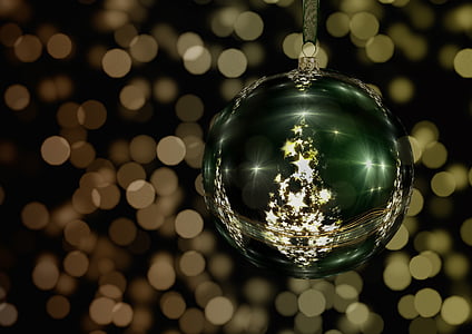 green and gold bauble with bokeh background thumbnail