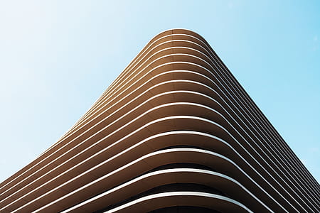 brown concrete structure under blue sky during day time thumbnail