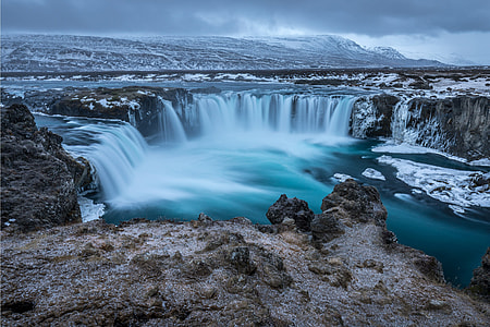 Waterfalls and winter snow in Iceland thumbnail