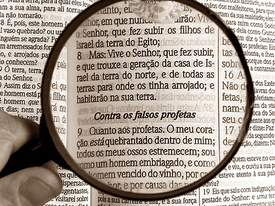 person holding magnifying glass thumbnail