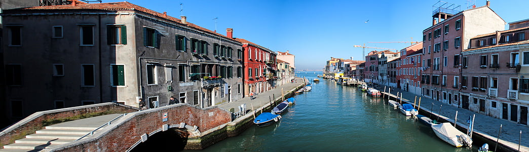 buildings on body of water at daytime thumbnail