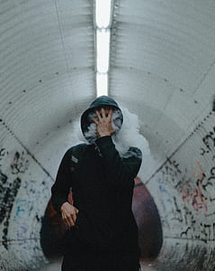 person smoking while touching face thumbnail