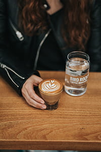 person holding coffee latte thumbnail