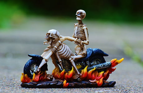 skeleton riding chopper motorcycle figurine on ground thumbnail