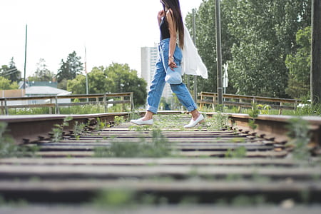 woman walking on train railway thumbnail