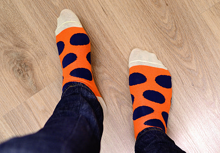 person in orange and blue socks thumbnail