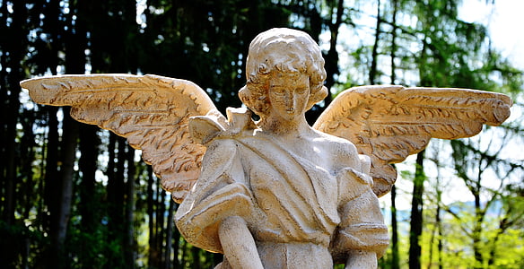 photo of beige concrete angel statue during daytime thumbnail