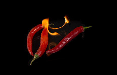 three red burning chilis thumbnail