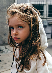 woman in white hoodie standing outdoors thumbnail