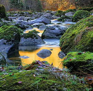 body of water surrounded by stones thumbnail