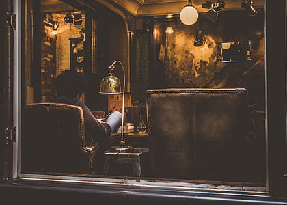 man sitting on brown armchair painting thumbnail