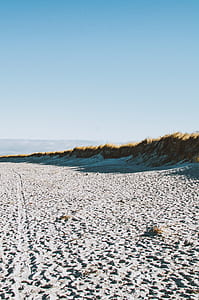 gray sand under blue sky thumbnail