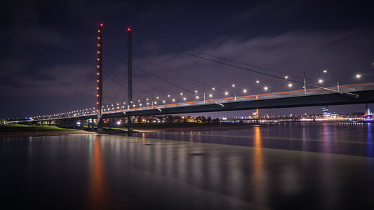 gray bridge during nighttime thumbnail