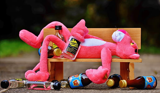 pink panther plush toy lying on bench thumbnail
