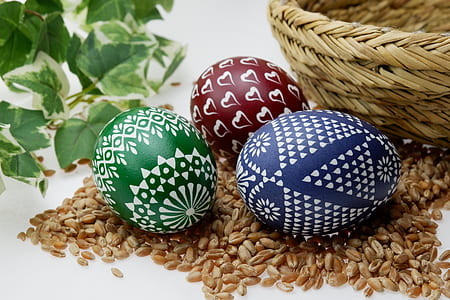 green, red, and blue egg trinkets on brown rice thumbnail