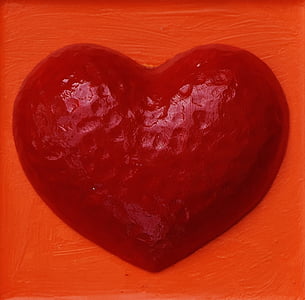 heart-shaped red ornament on orange panel thumbnail