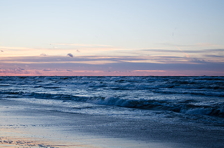 body of water during sunset thumbnail