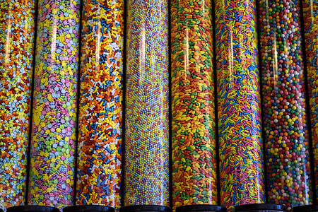 assorted-color toppings in clear glass containers thumbnail