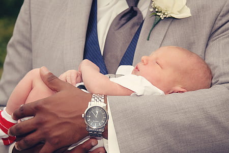 man in round silver-colored analog watch with link bracelet thumbnail