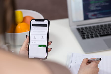 Person Holding Iphone X and Ballpoint Pen thumbnail
