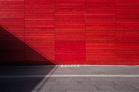 red concrete wall during daytime thumbnail