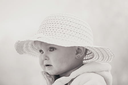 grayscale photo of baby wearing white knitted hat thumbnail