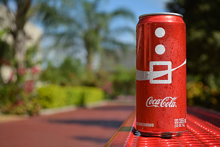 Coca Cola can on red surface thumbnail