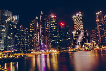 Photography Of High-Rise Building At Night Time thumbnail