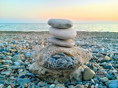 balanced stones on beach thumbnail