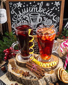 two filled clear glass mugs on brown wood slab coasters thumbnail