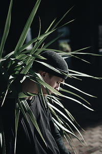 man near green plant thumbnail
