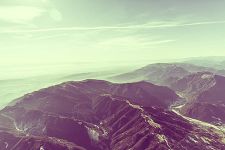 Mountains during Daytime and White Cloudy Sky thumbnail