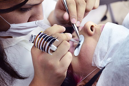 close-up photo of doctor operating person's eyelash thumbnail