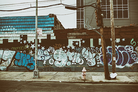 Wide angle shot of a graffiti-covered street in Williamsburg, Brooklyn, New York City thumbnail