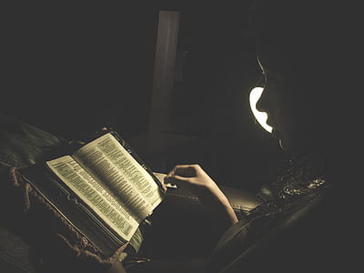 woman wearing book inside room thumbnail