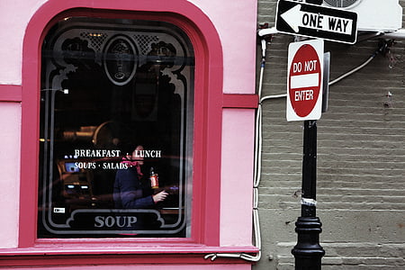 photo of pink building near pole thumbnail