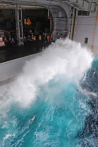 waves splashing near open structure thumbnail
