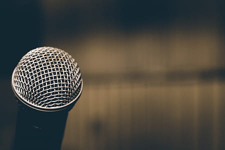 selective focus photography of silver dynamic microphone thumbnail