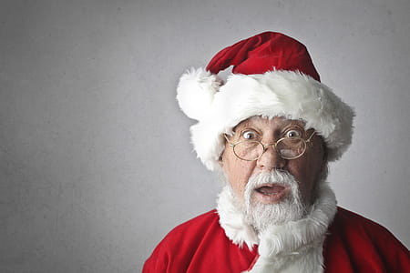 Old Aged Man wearing a Santa Claus costume and making surprised face on Isolated On Grey Background thumbnail