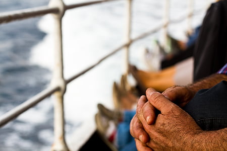 selective focus photography of person holding his knee thumbnail