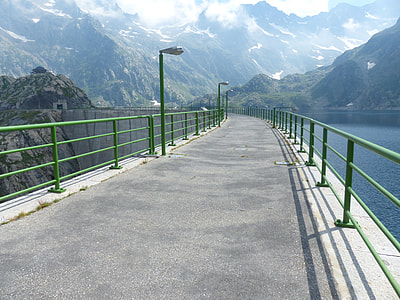 empty road between body of water thumbnail
