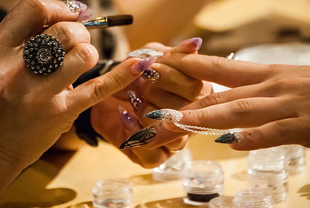 person wearing black ring thumbnail