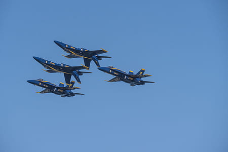 four blue fighter jets in the sky thumbnail