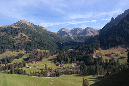 landscape photography of hill under blue sky at daytime thumbnail